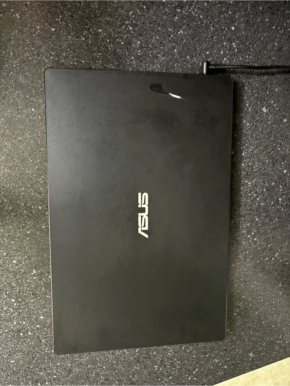 ASUS Black Laptop with Yellow-Accent Key